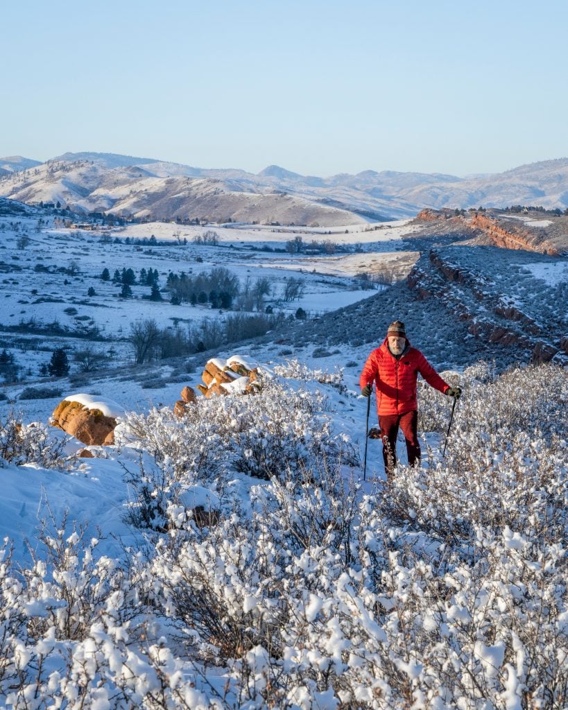 man hiking in lory state park in winter when visiting fort collins colorado