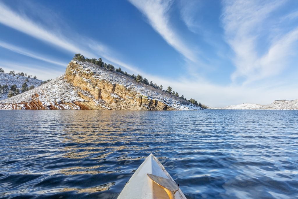 front tip of a canoe on the water in fort collins winter