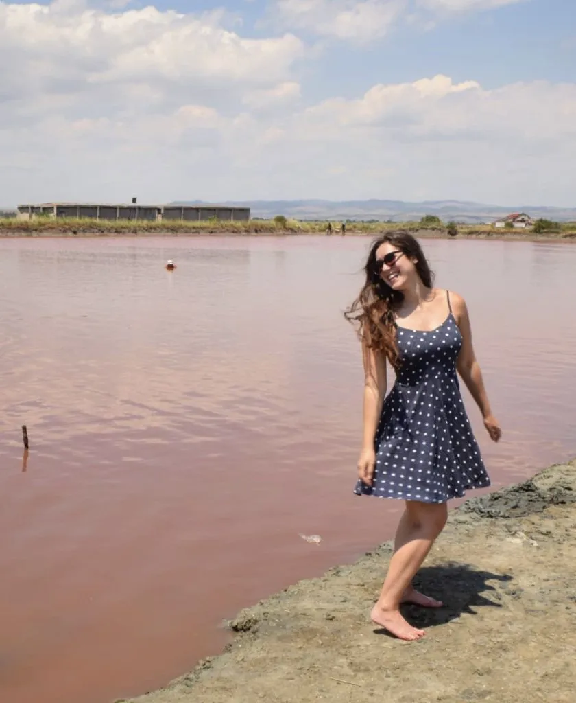kate storm in front of a pink lake in burgas bulgaria