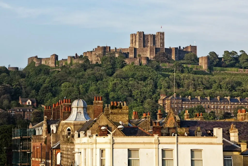 castle standing above city rooftops in dover united kingdom