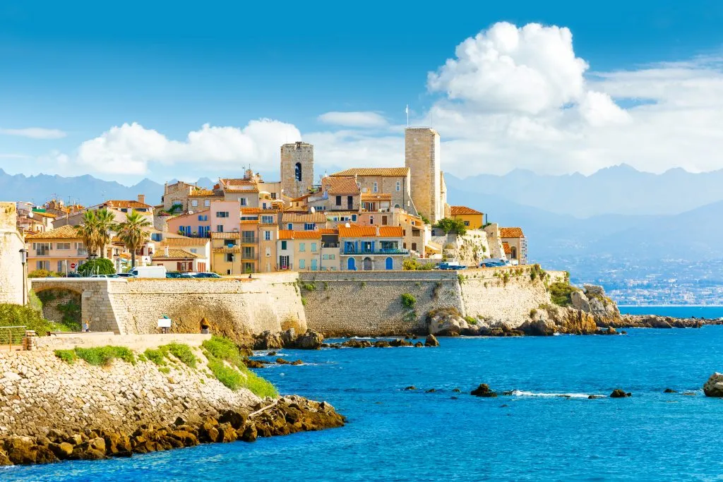 view of antibes from with water in the foreground, one of the most beautiful cities with beaches europe