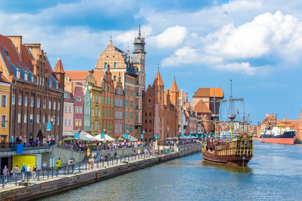 historic center of gdansk poland on the water with tall ship in the water, one of the best coastal cities in europe to visit