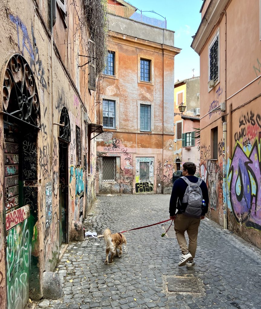jeremy storm and ranger storm walking down a graffiti laden street when visiting trastevere rome