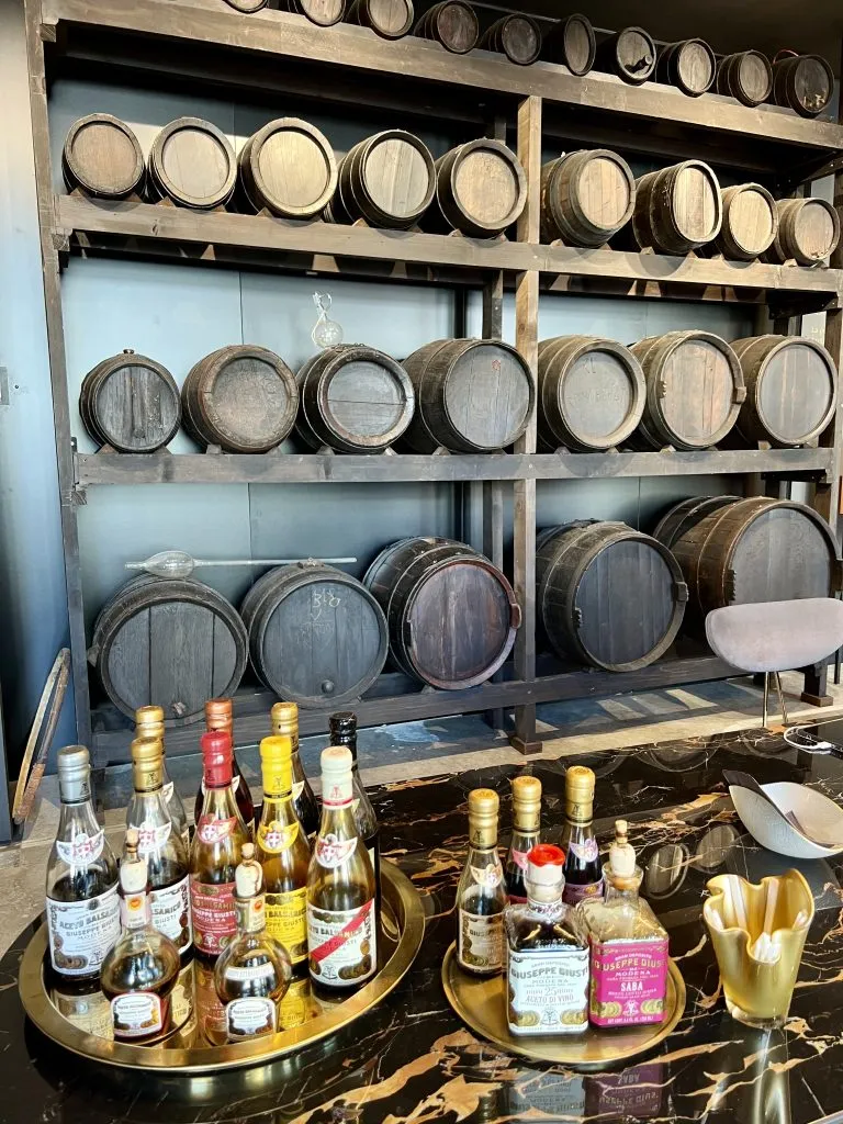 balsamic vinegar shop in modena emilia romagna italy with several bottles set out for tastings