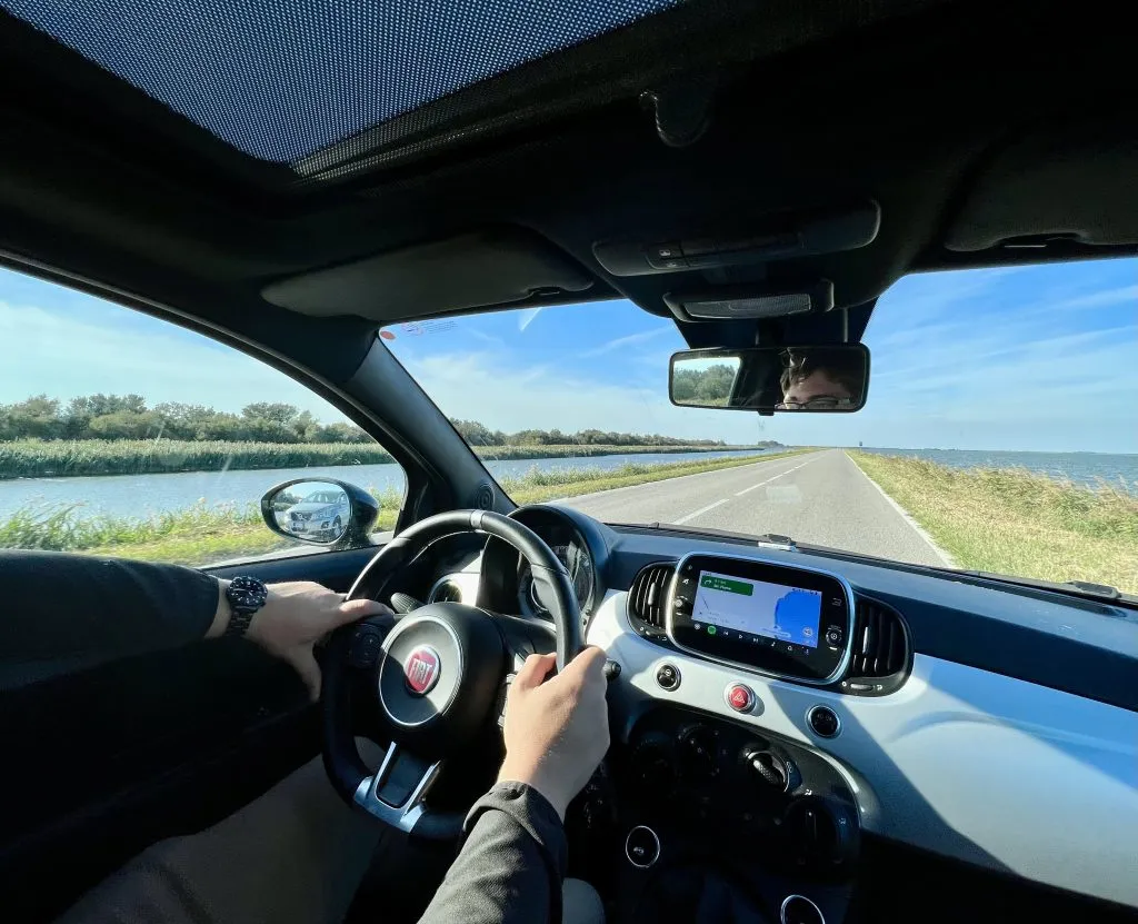 jeremy storm driving a fiat to comacchio on an emilia romagna road trip