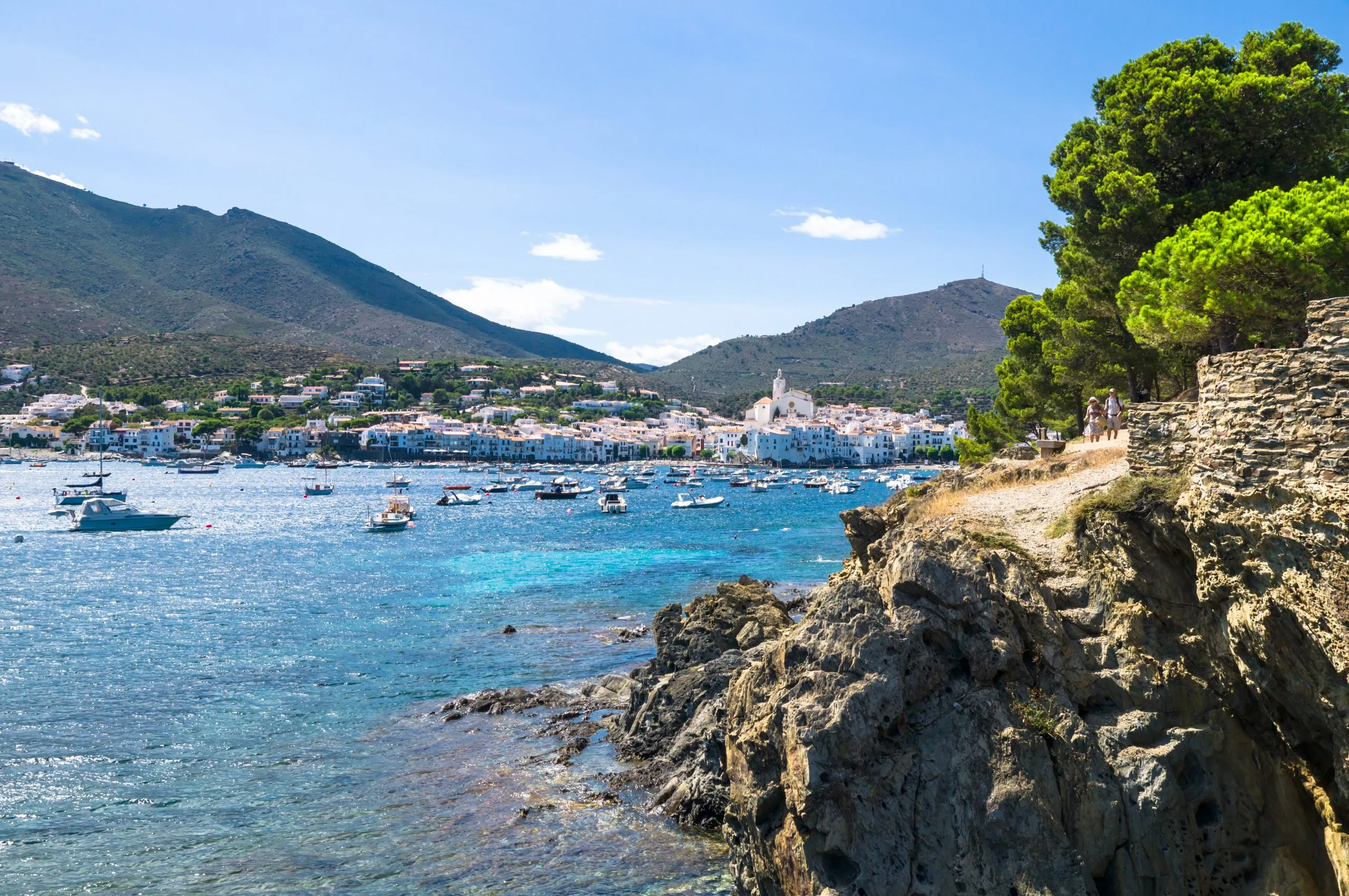 view of the coastal catalonia town of cadaques from across the water, one of the best day trips from barcelona spain