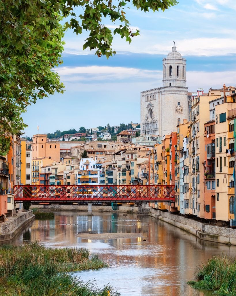 view of girona spain jewish quarter with river in the foreground