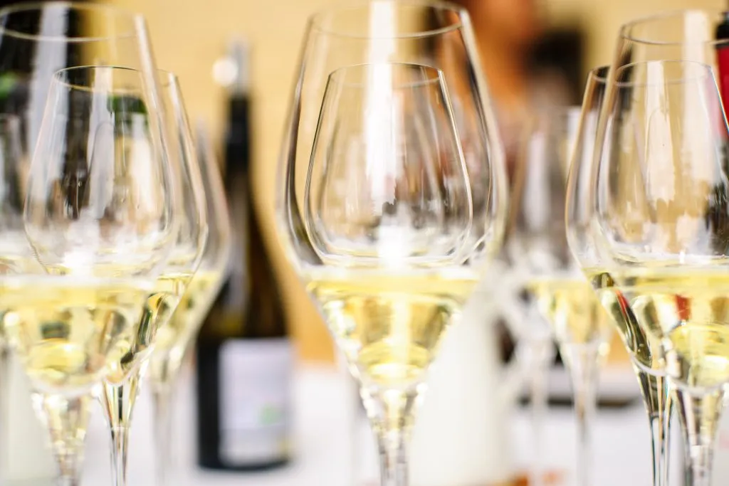 white wine glasses poured for a tasting