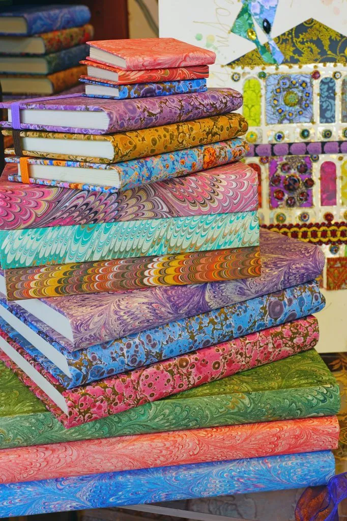 stacks of notebooks made with venetian marbled paper
