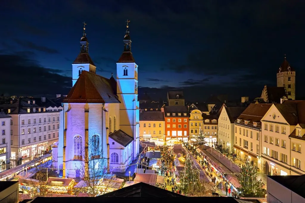 view of regensburg christmas market from above at night in bavaria in december