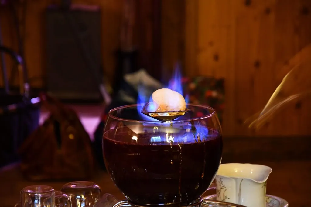 Feuerzangenbowle with a sugar loaf burning over gluhwein