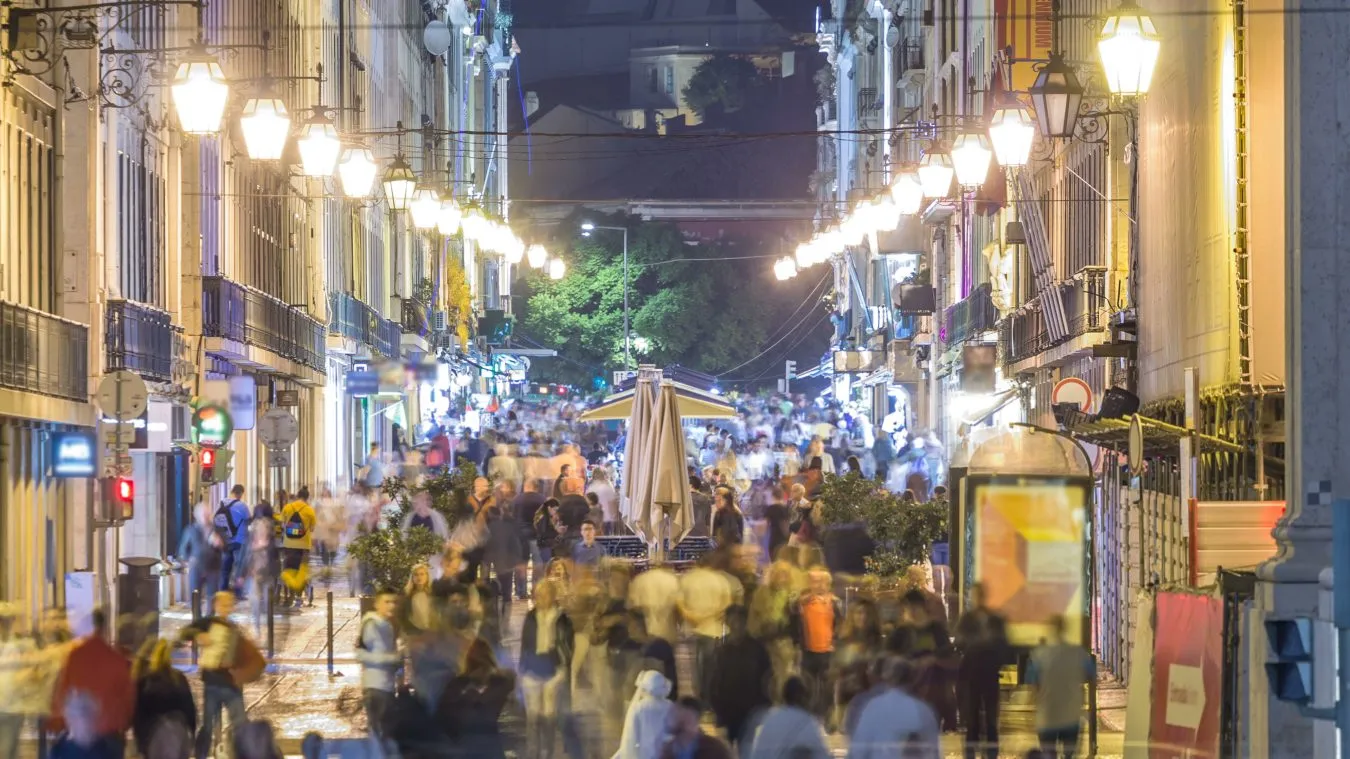 crowds of people on rua augusta at night lisbon portugal