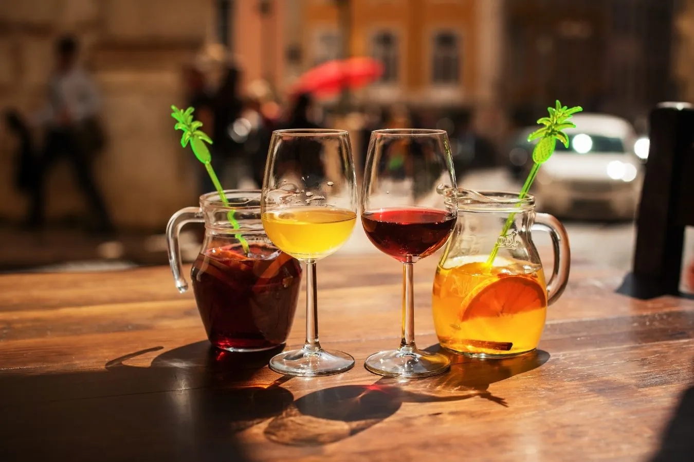 collection of drinks outsisde at a bar in lisbon evening