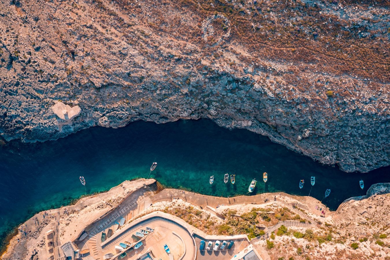 aerial view of wied-iz zurrieq and tourist boats ready to visit blue grotto