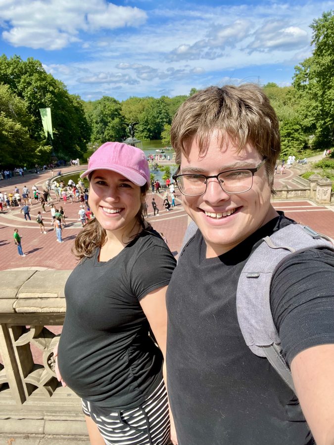 kate storm and jeremy storm taking a selfie at bethesda terrace in nyc when kate is pregnant, both wearing black t shirts