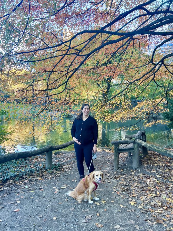 kate storm while pregnant and ranger storm in central park during fall foliage season, with a tree covered in foliage behind them