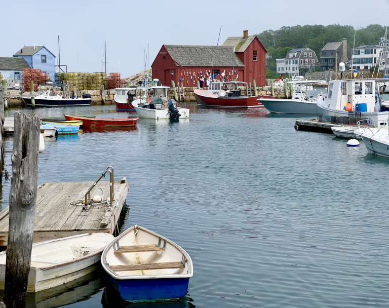 photo of motif no. 1 red building in rockport massachusetts as seen from across the harbor, one of the best day trips from boston in new england