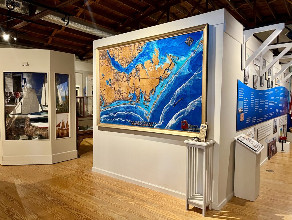 inside of carteret county historical museum with a map of the crystal coast in the foreground