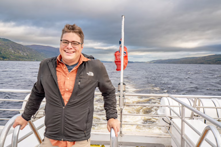 jeremy storm standing on a boat during a loch ness cruise inverness scotland things to do