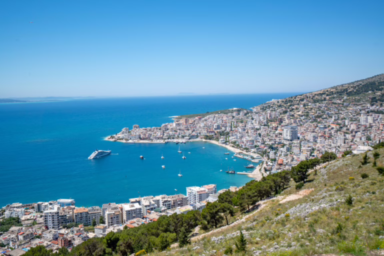 view of saranda albania from lekursi castle, visiting the castle is one of the best things to do in saranda albania. ionian sea visible in the distance